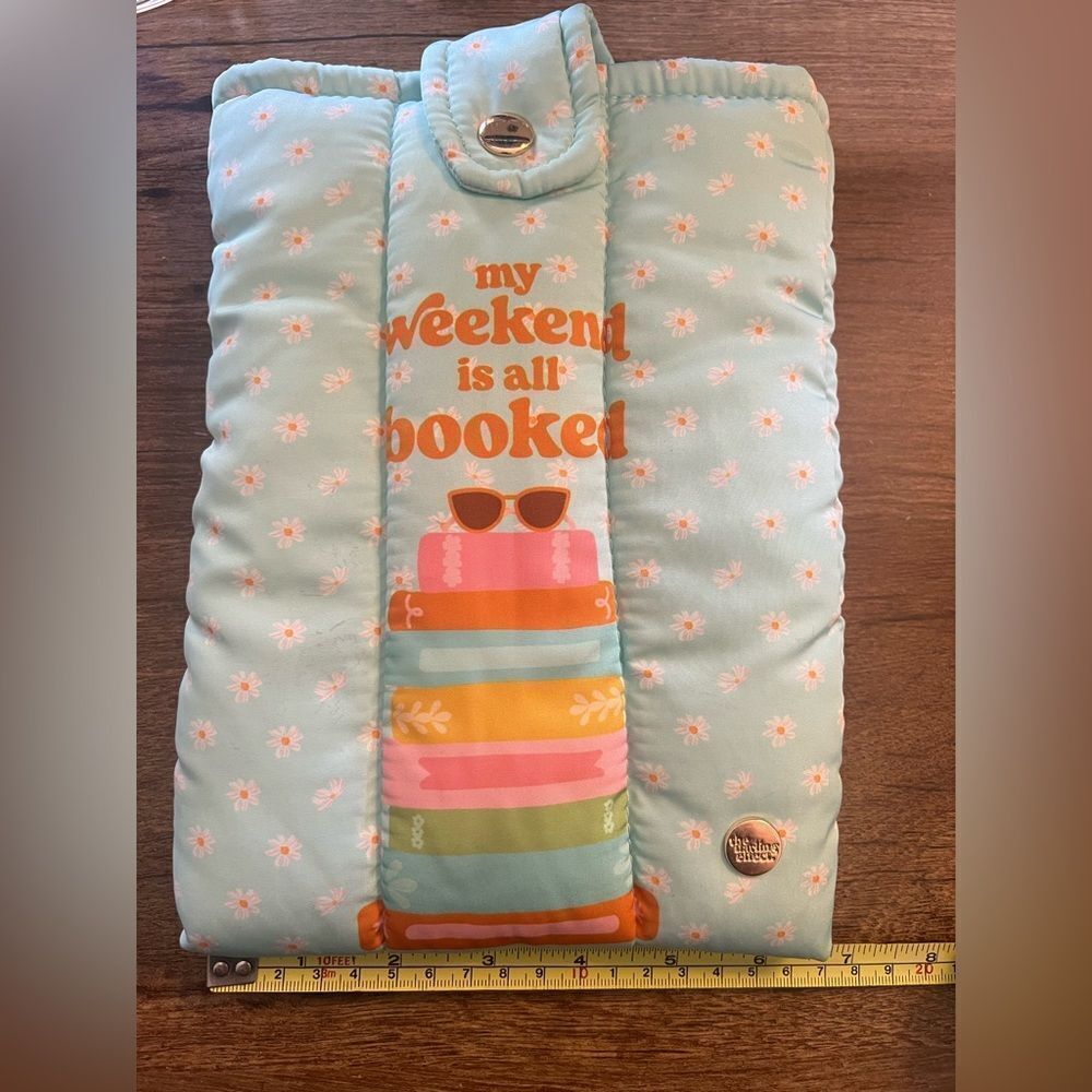 Light Blue Quilted Book Sleeve with Orange Text